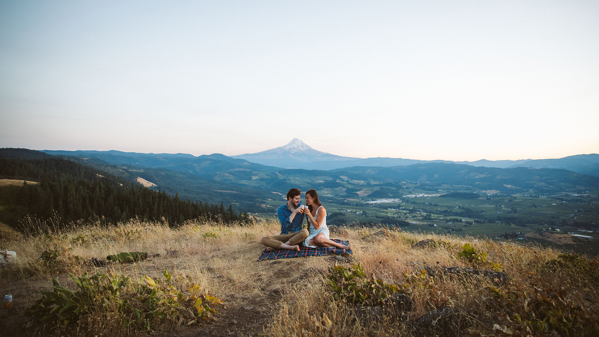 Cinematic engagement photo in Oregon with Mount Hood in the background