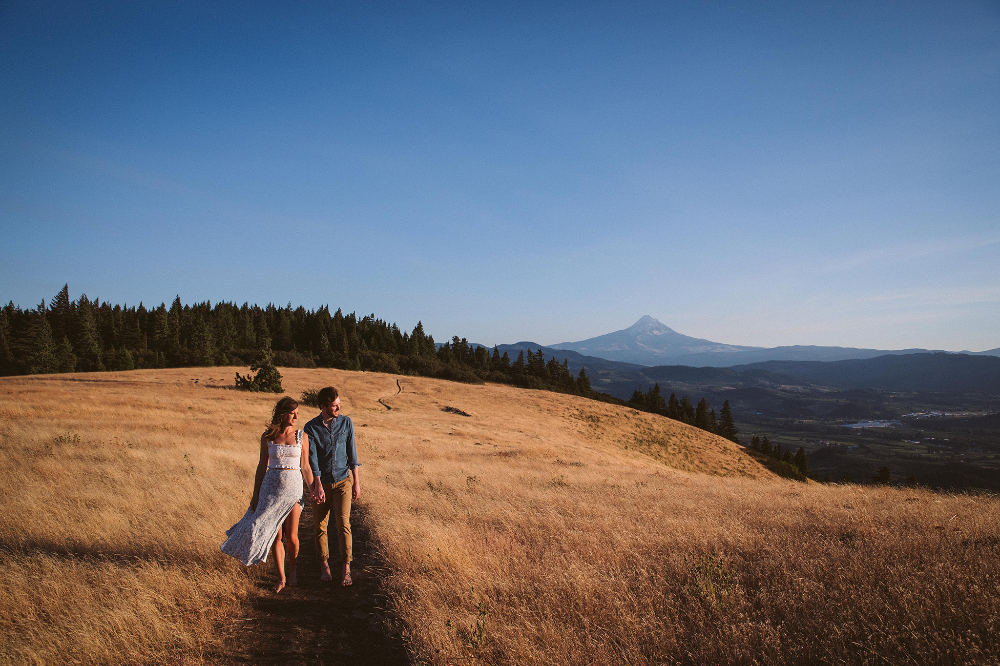 A sunny summer engagement photo in Hood River, Oregon