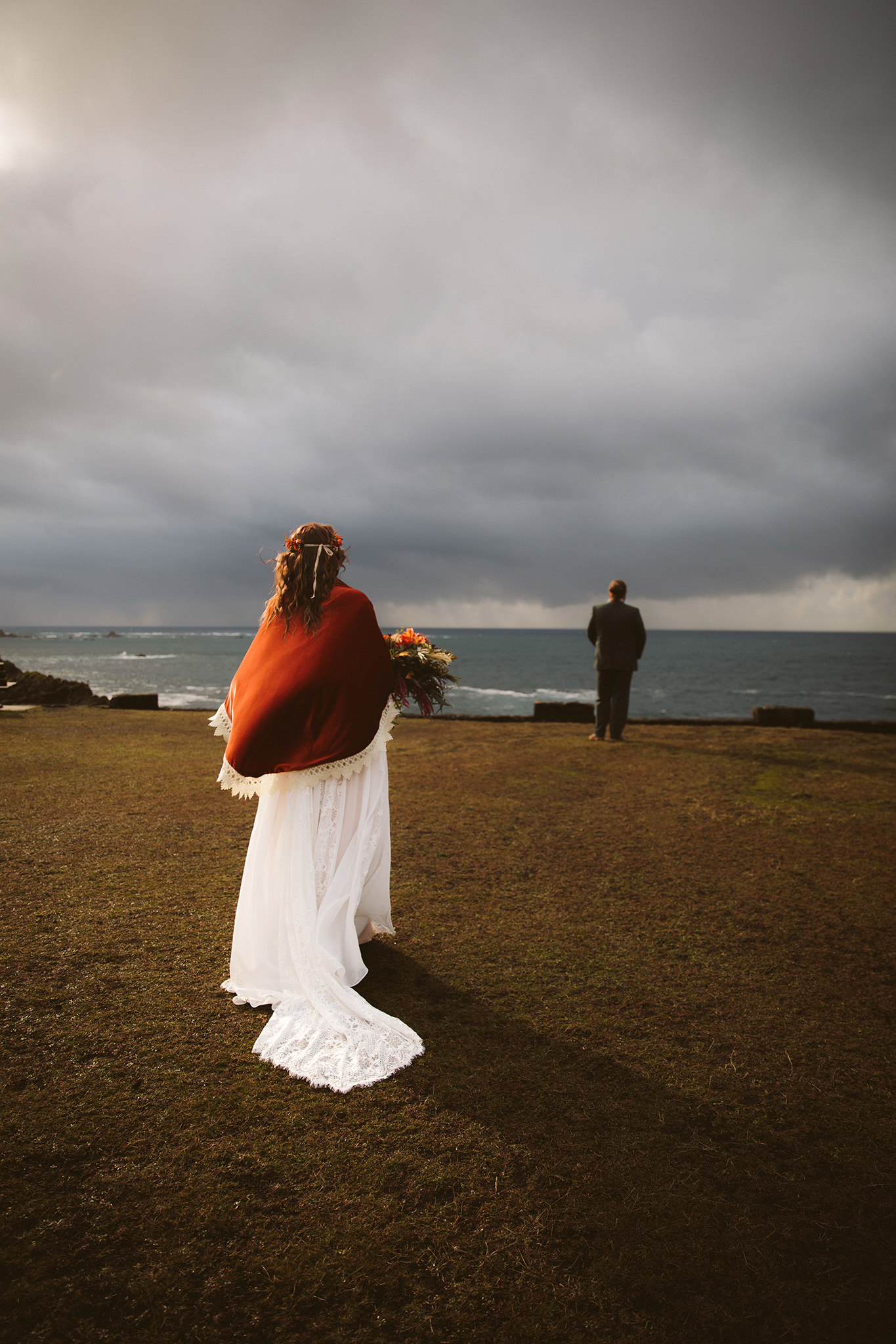 A cliffside first look photo at a shore acres state park wedding