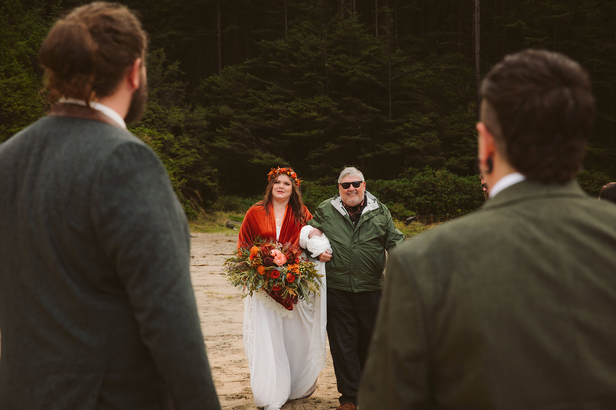 A father walking a bride down the aisle at her Simpson beach elopement in Coos Bay, Oregon