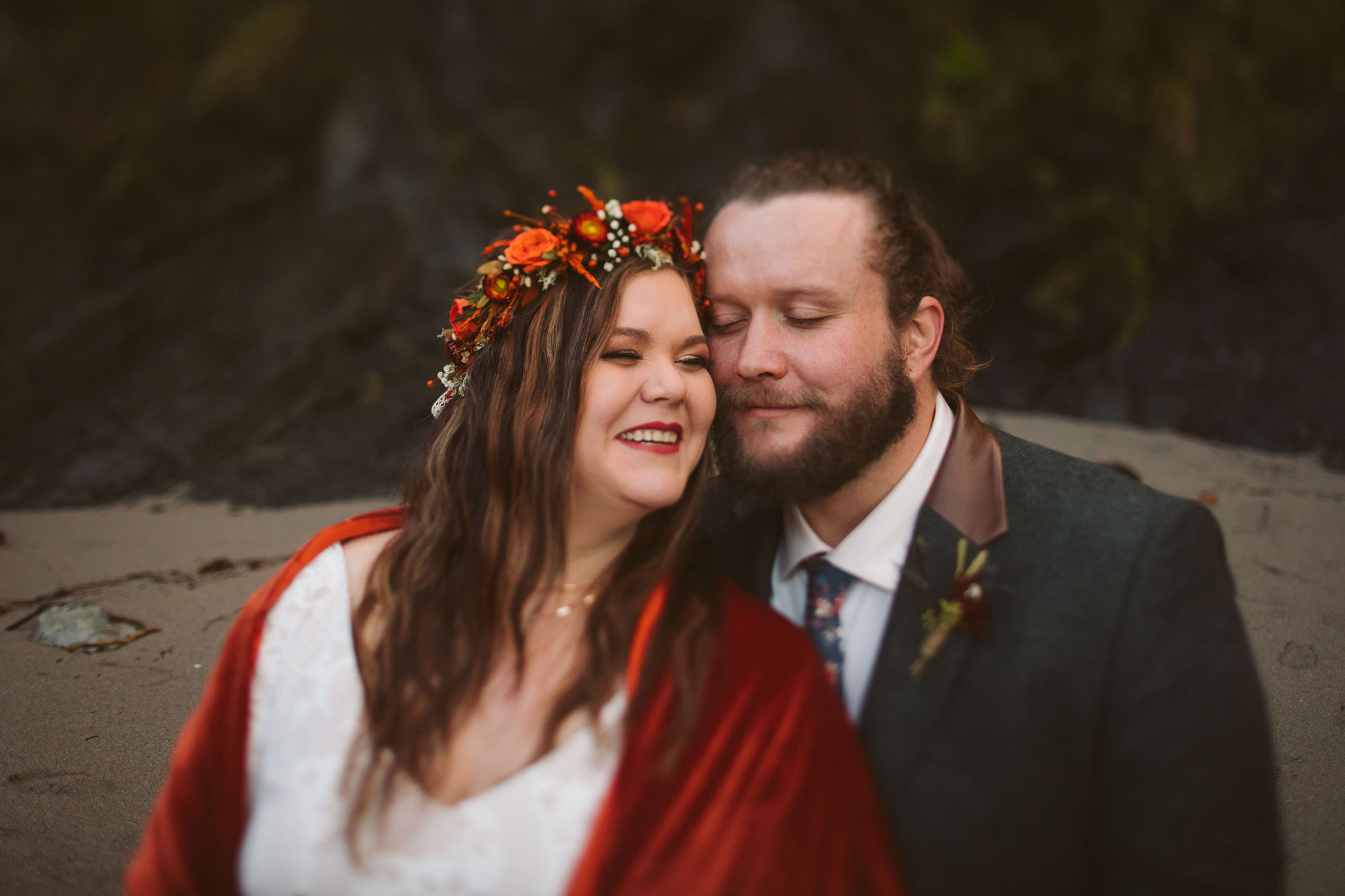 A portrait of a bride and groom during their Autumn Oregon coast wedding