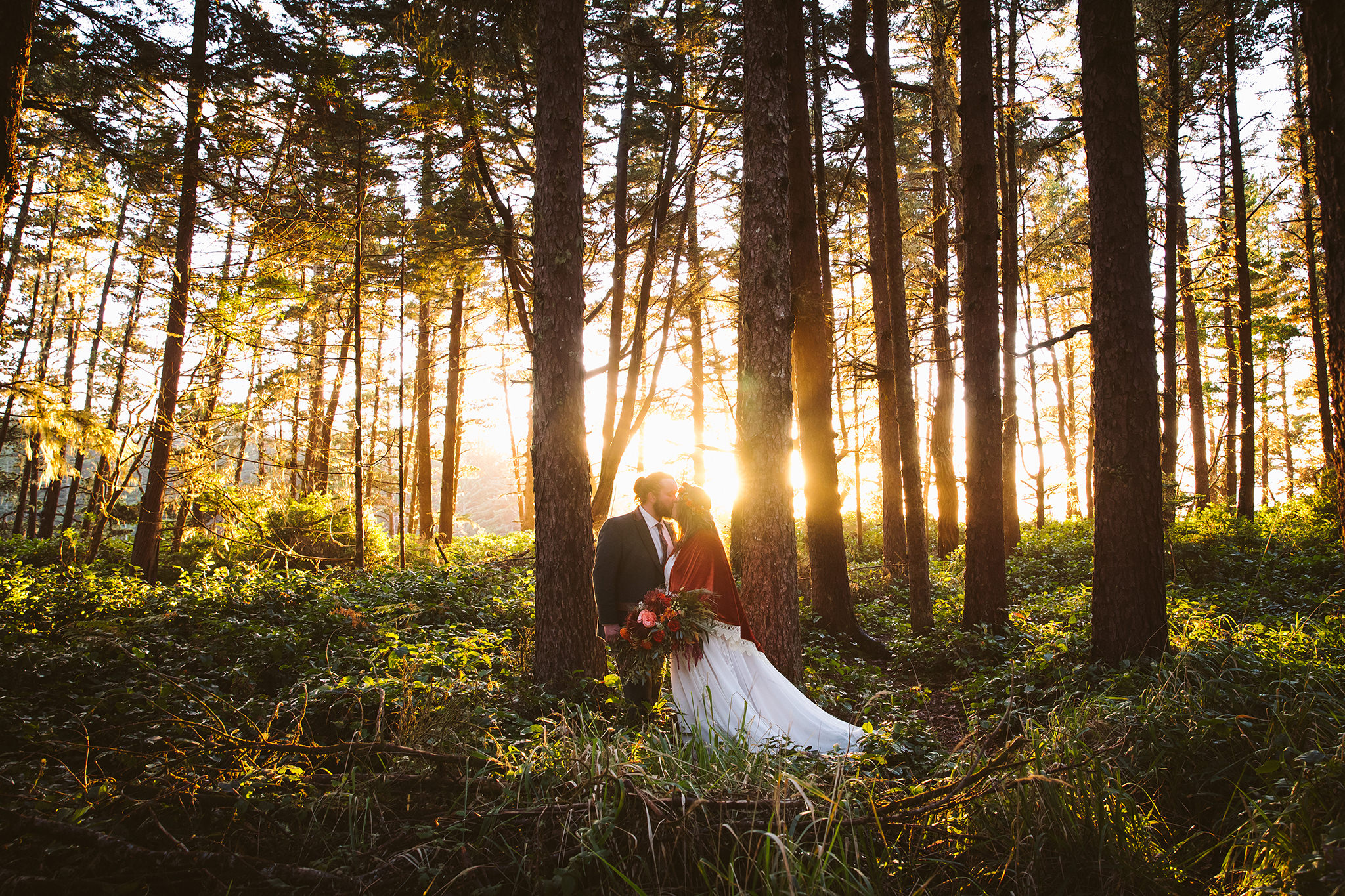 A couple during their woodsy Oregon elopement at golden hour 